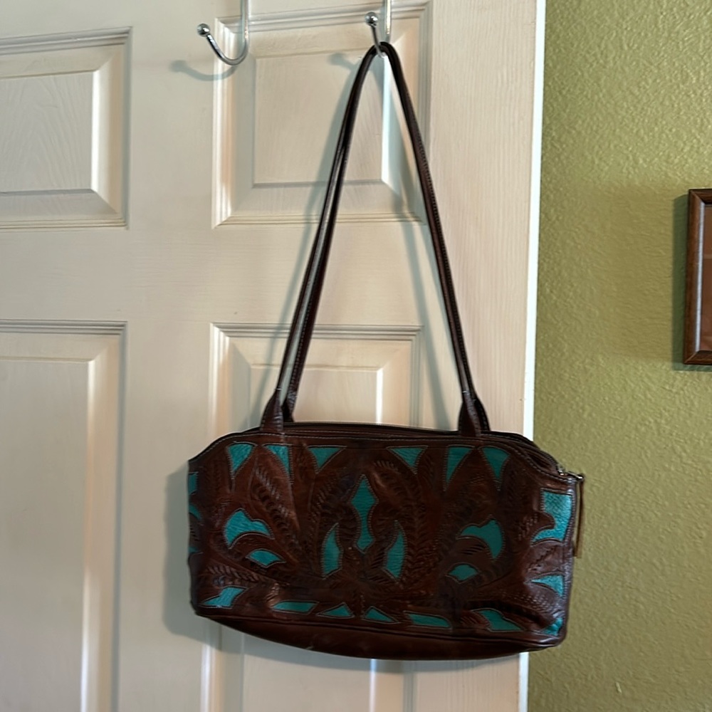 Leaders in leather hand bag cut out design